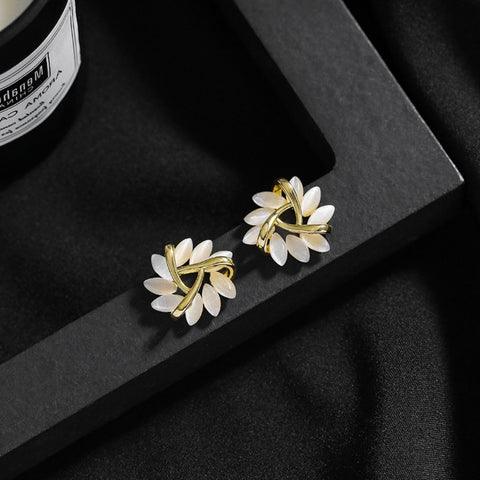 Beautiful women's floral Sakura Blossom stud earrings with shimmering opal, a stunning piece of jewelry.