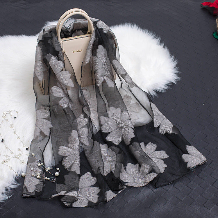 Elegant women's silk floral scarf featuring a beautiful cut-out design.