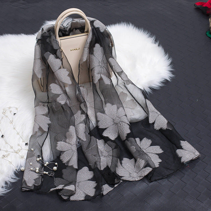 Elegant women's silk floral scarf featuring a beautiful cut-out design.