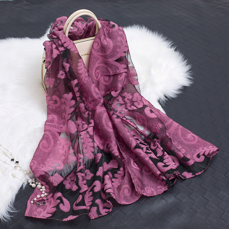 Elegant floral cut-out silk scarf, a versatile women's fashion accessory.