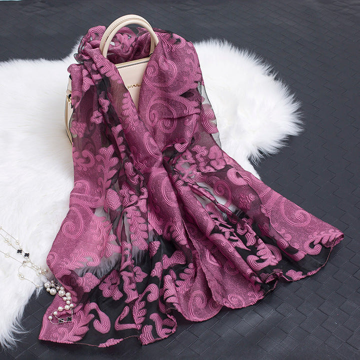 Elegant floral cut-out silk scarf, a versatile women's fashion accessory.