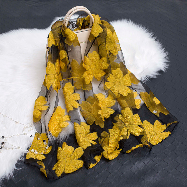 Chic lightweight floral cut-out silk scarf, an essential fashion accessory.