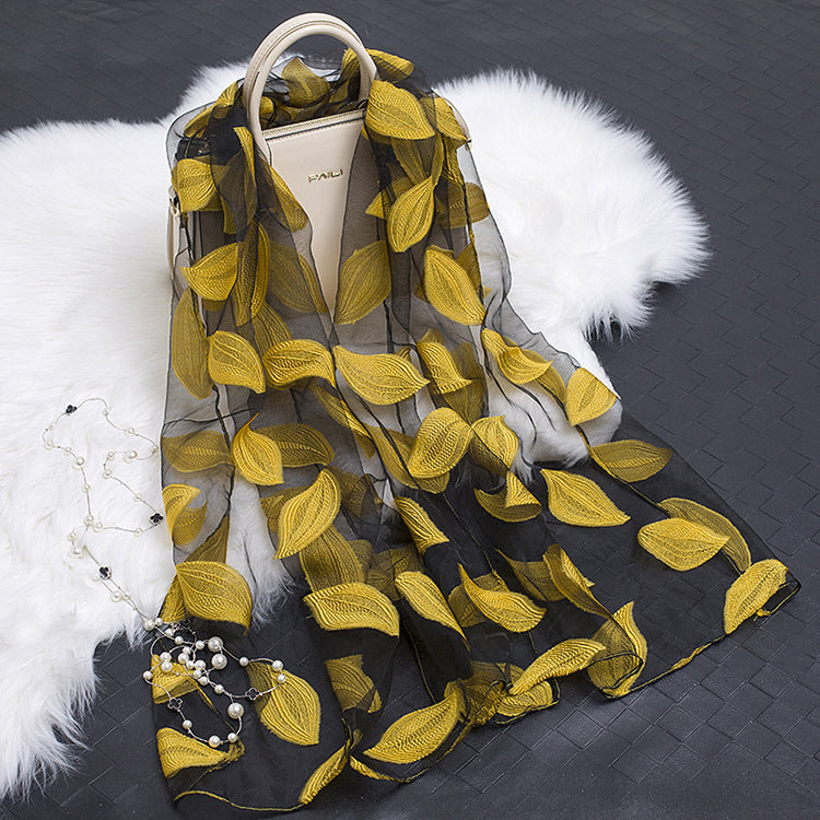 Exquisite women's silk scarf, showcasing a floral and cut-out design.