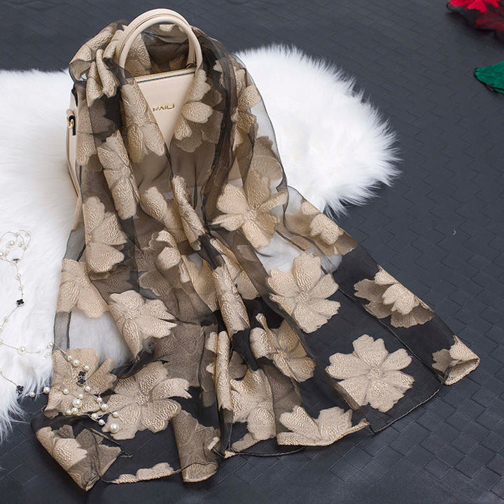 Delicate women's organza floral scarf with a captivating cut-out pattern.