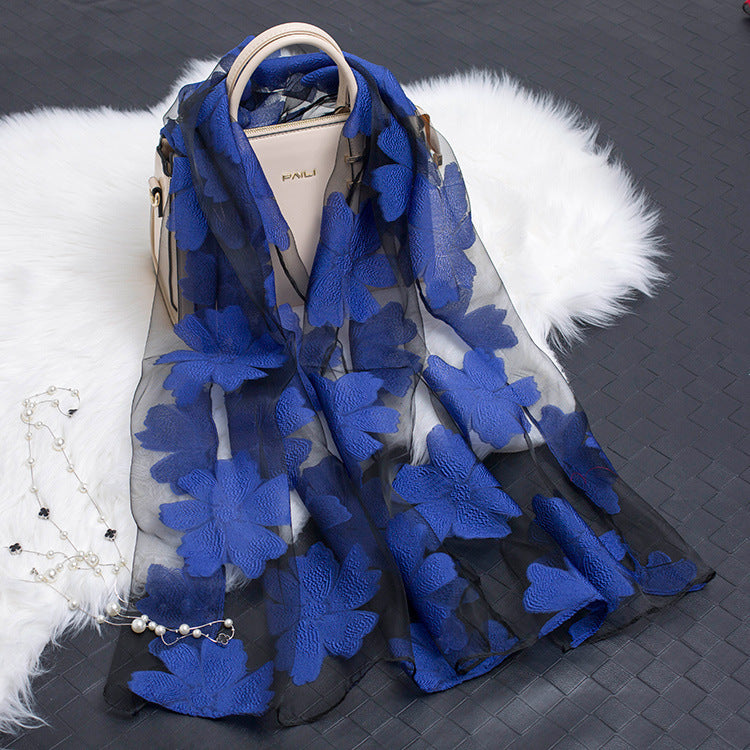 Chic women's floral pattern silk scarf with an intricate cut-out finish.