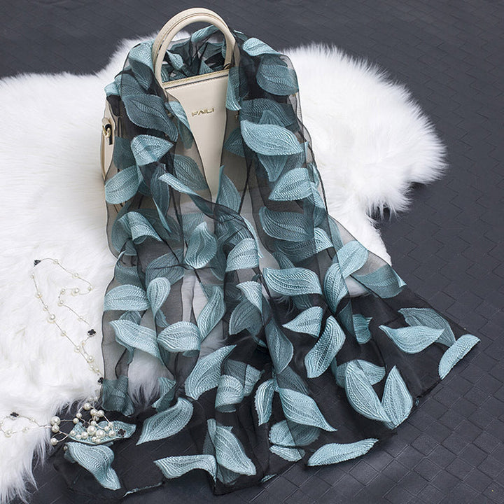 Stunning lightweight floral cut-out silk scarf, a versatile accessory.