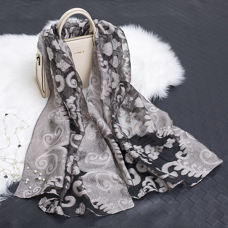 Versatile floral cut-out silk scarf for women, perfect for all seasons.
