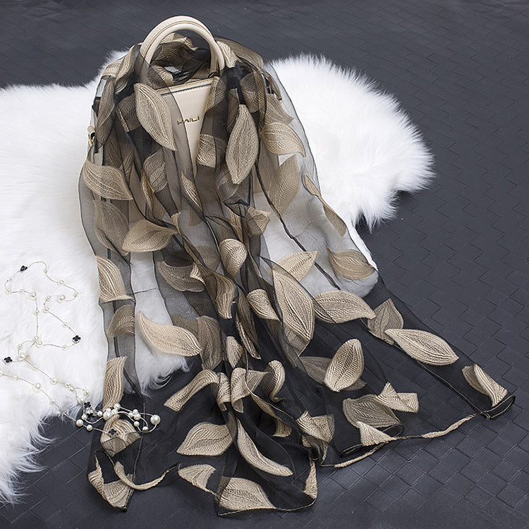 Delicate women's silk floral scarf featuring a gorgeous cut-out pattern.