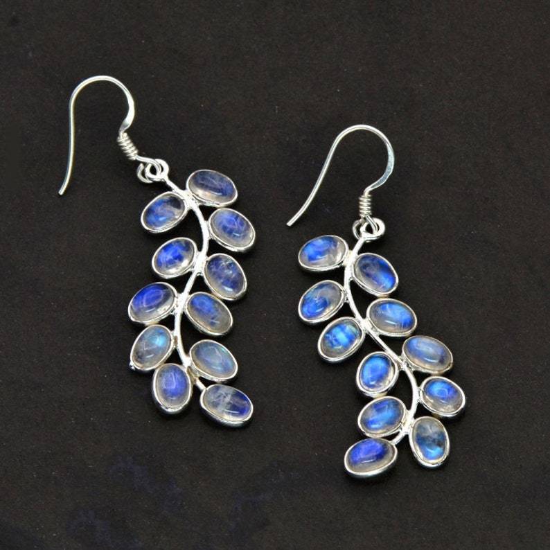 Elegant women's silver drop earrings with enchanting moonstone gems, perfect for a sophisticated look or special gift.