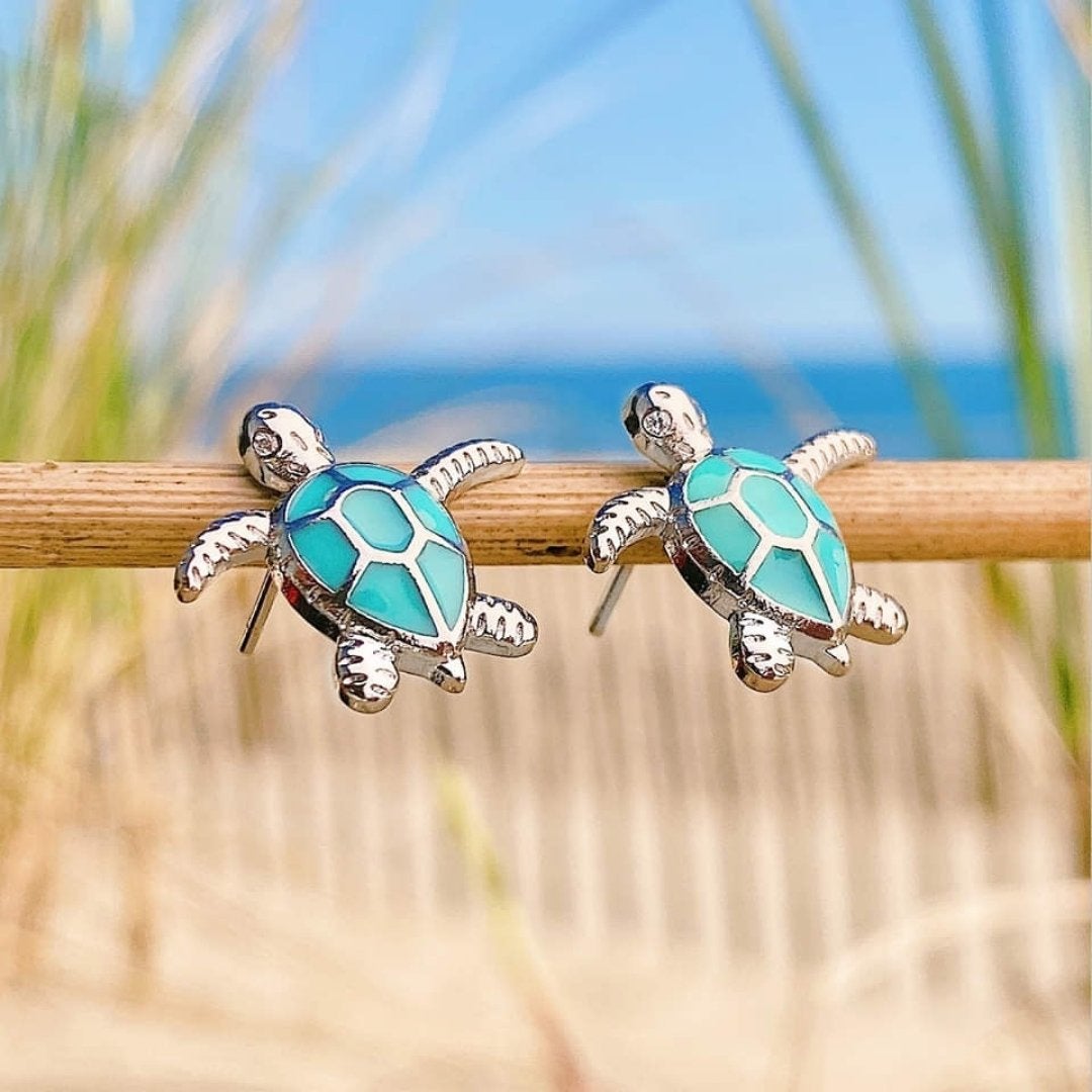 Elegant women's silver sea turtle dangle earrings featuring shimmering opal inlay, perfect ocean-inspired animal jewelry.