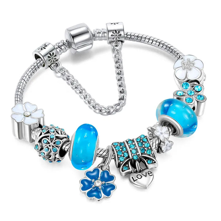 Elegant women's stainless steel charm bracelet featuring delicate peach blossom flowers, perfect fashion accessory for her.