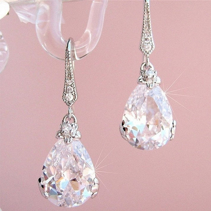 Women's elegant pear drop crystal earrings, sterling silver dangle style, ideal for special occasions.