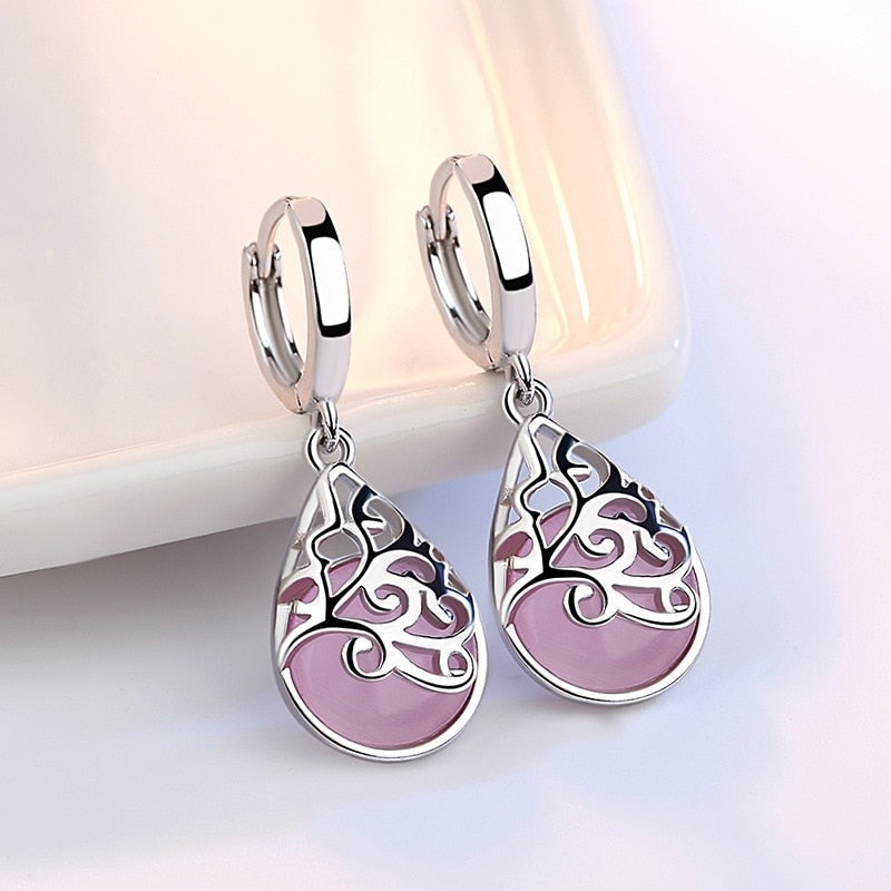 Elegant women's sterling silver Tree of Life earrings, symbolizing growth & connection. Perfect meaningful gift.