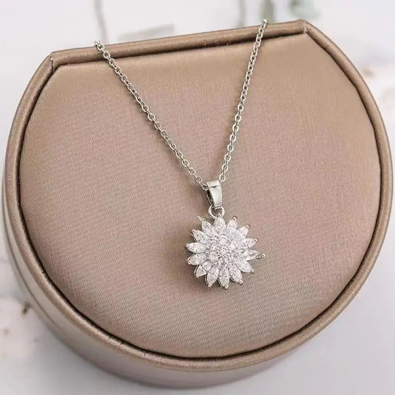 Rose gold sunflower spin duo necklace for women, elegant rotating pendant with an adjustable chain, fashion jewelry.