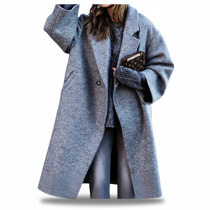 Close-up of the wool texture on a women's tailored winter coat, highlighting material richness.