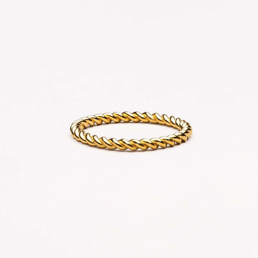 Elegant women's twisted symbolic ring, representing connection & love. Gold or silver everyday jewelry.