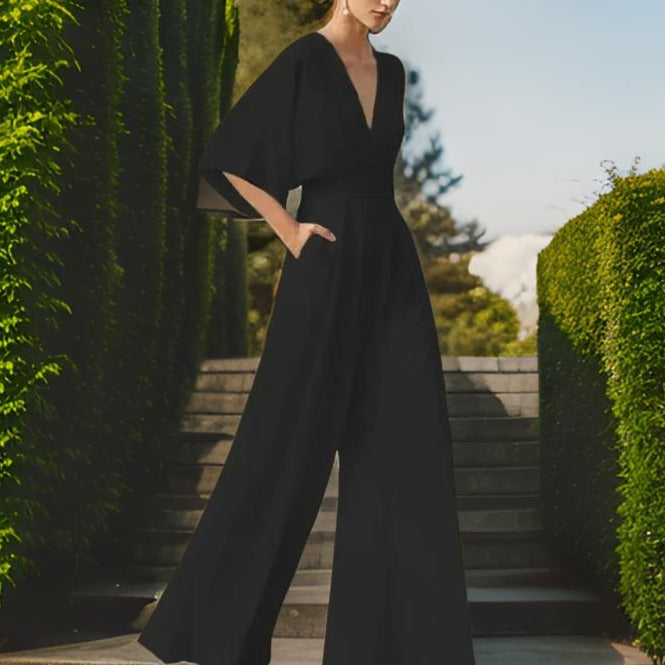 Versatile women's elegant V-neck jumpsuit with three-quarter sleeves. Ideal for chic casual or formal style.