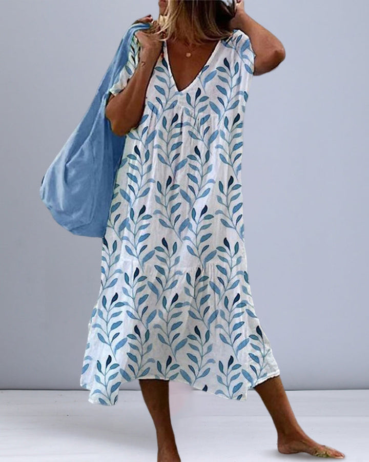 Elegant women's V-neck leaf print midi dress, perfect for summer casual wear or vacation. Lightweight & stylish.