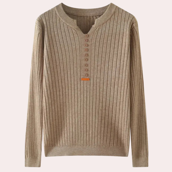 Winter wardrobe essential: women's v-neck sweater with decorative button details.