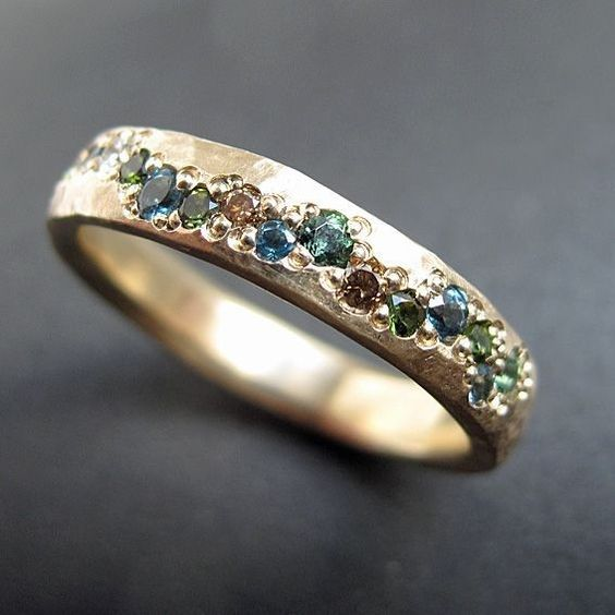 Elegant women's vintage golden ring featuring colorful crystals. A classic statement jewelry piece for her.