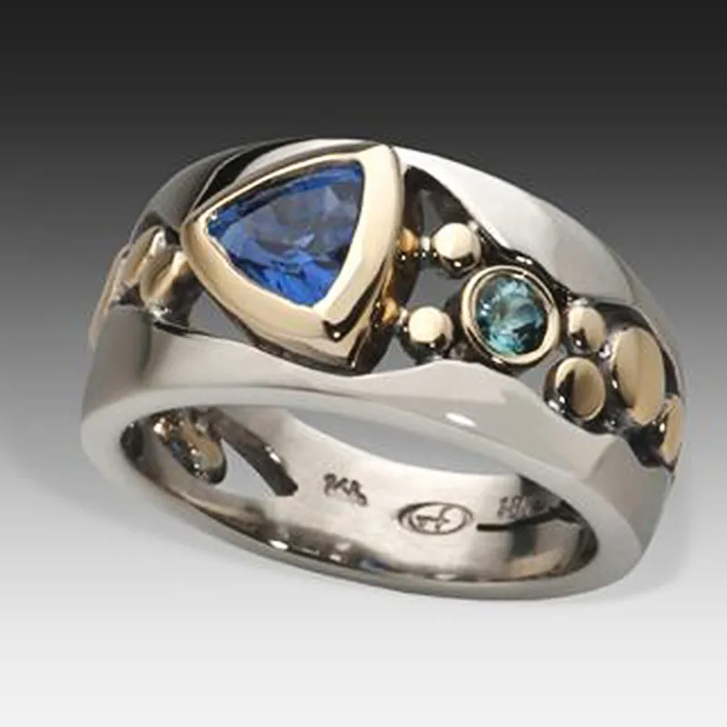Elegant women's vintage silver ring featuring a sparkling blue gemstone, a classic jewelry accessory.