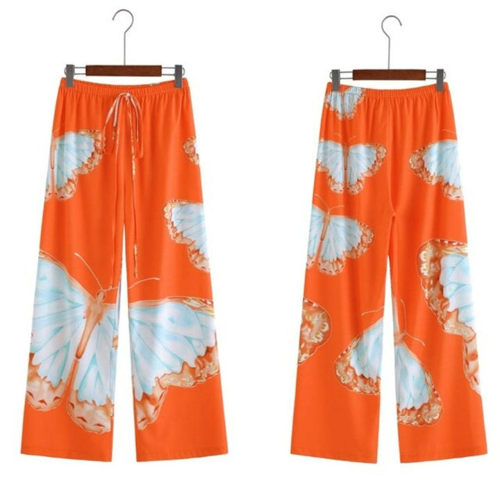 Flowy Liana wide leg chiffon trousers for women with an elastic waist, ideal for comfortable summer fashion.