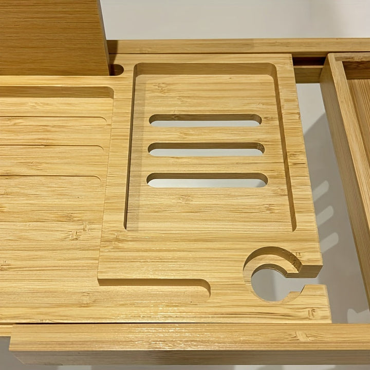 Close-up of a bamboo bathtub caddy showcasing multiple compartments and extendable design for ultimate bath relaxation