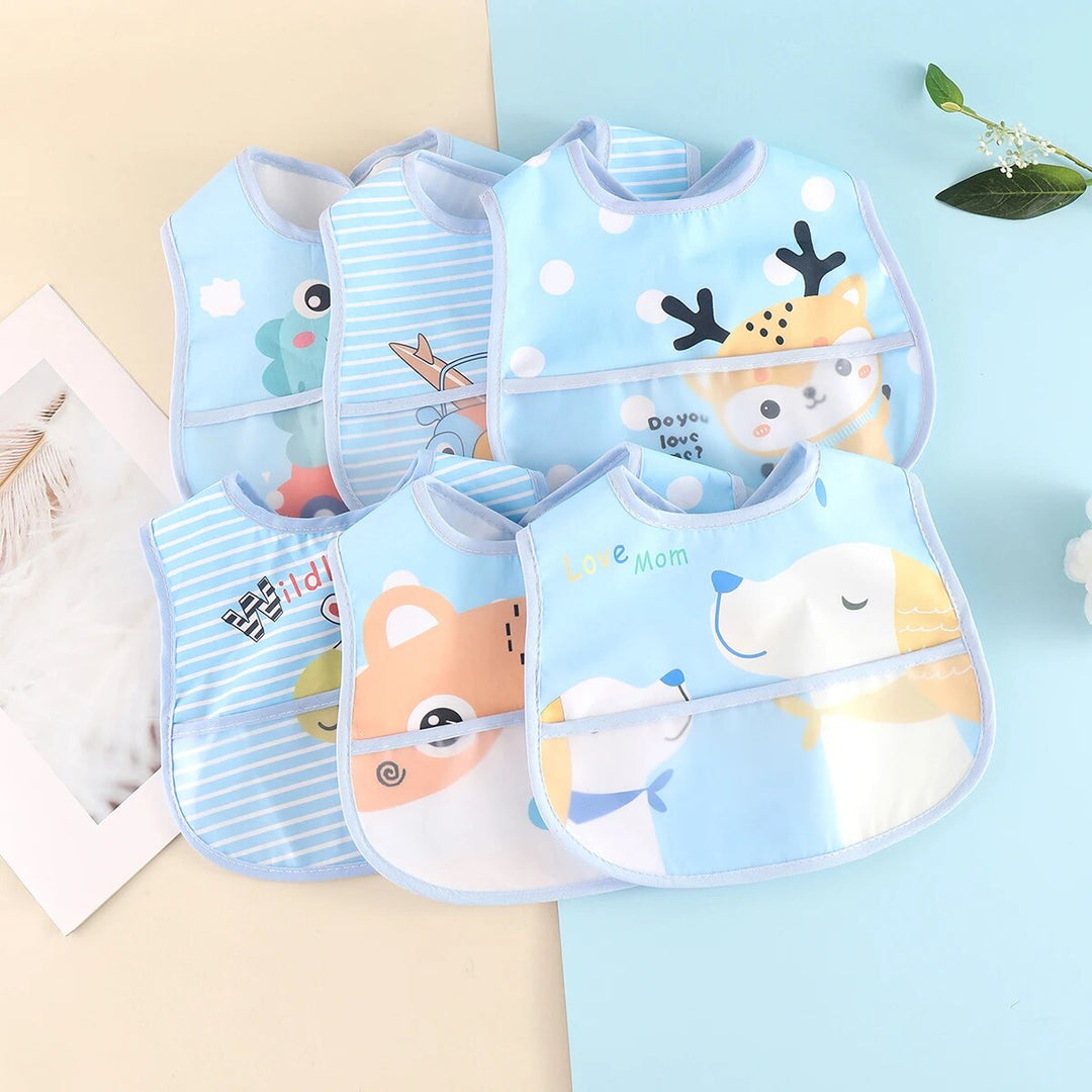 Detail of the textured, waterproof material of an adjustable baby bib designed for messy mealtime