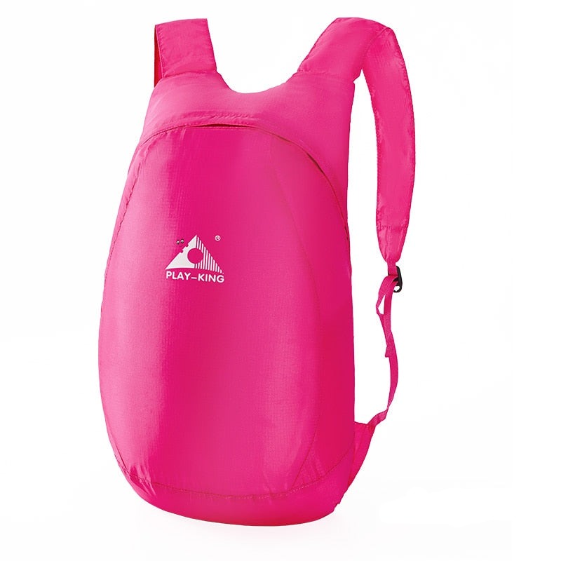 Close-up of the water-resistant fabric and reinforced stitching of a 20L travel backpack.
