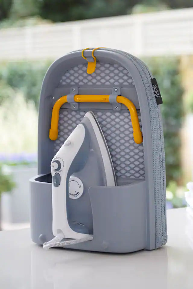 Compact PressEase ironing board for small spaces, featuring innovative DripLock steam absorption