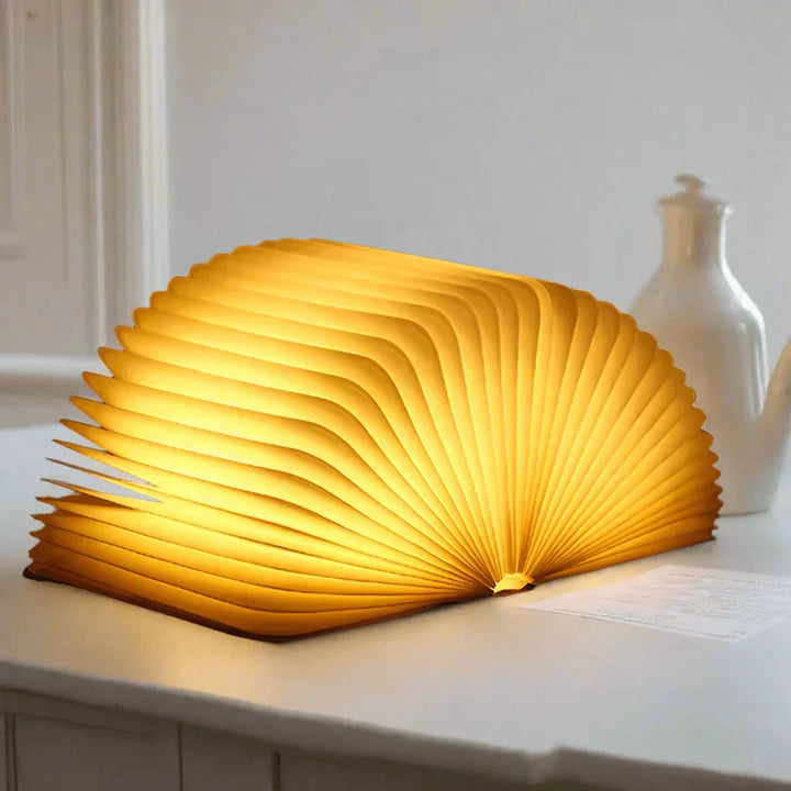 Create cozy ambiance with StoryGlow folding LED book lamp, offering soft, warm mood lighting.