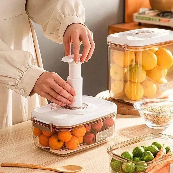 Clear FreshLock food preservation container, showcasing its vacuum seal technology with a hand pump.