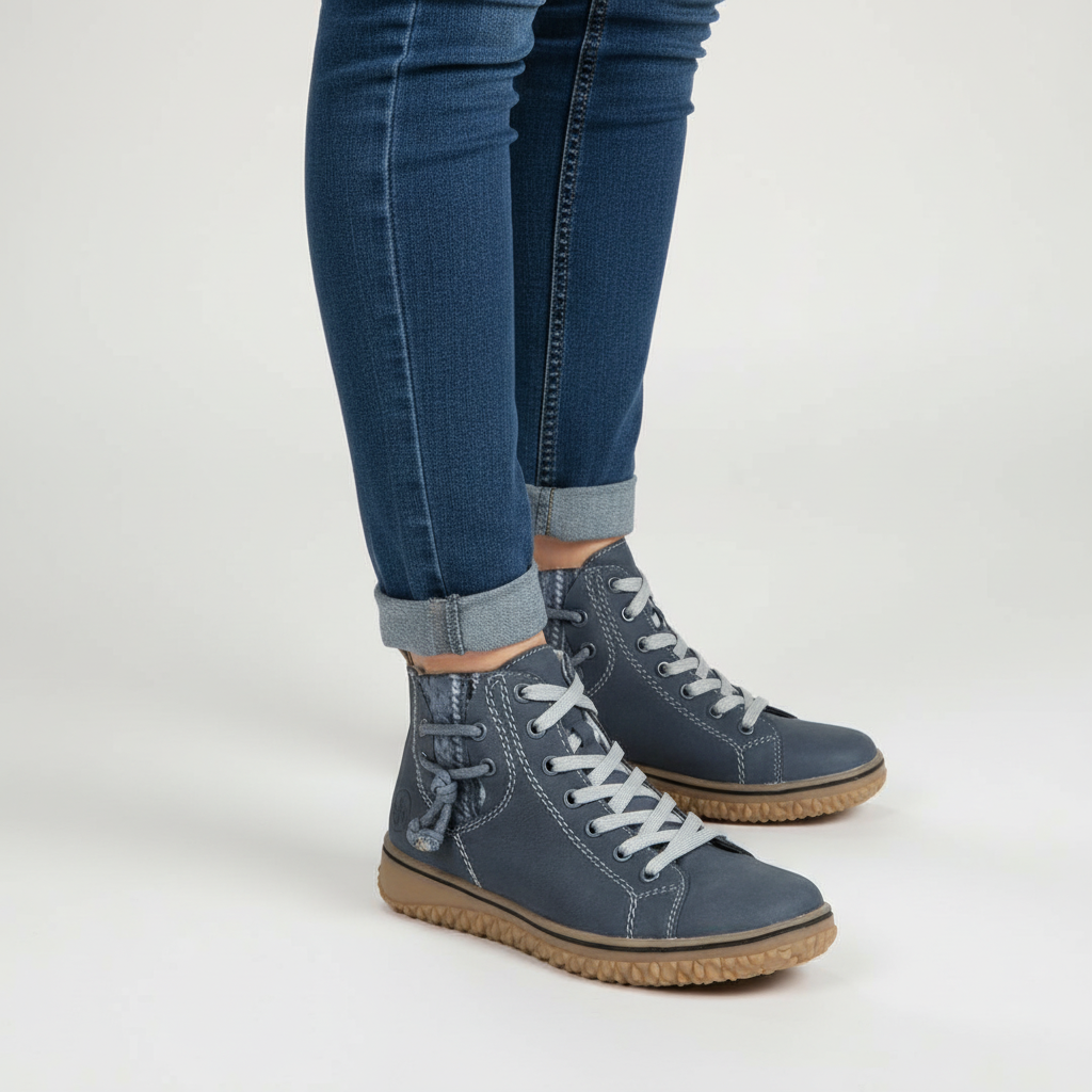 Woman wearing Gina black insulated ankle boots, showcasing warmth and flexible sole