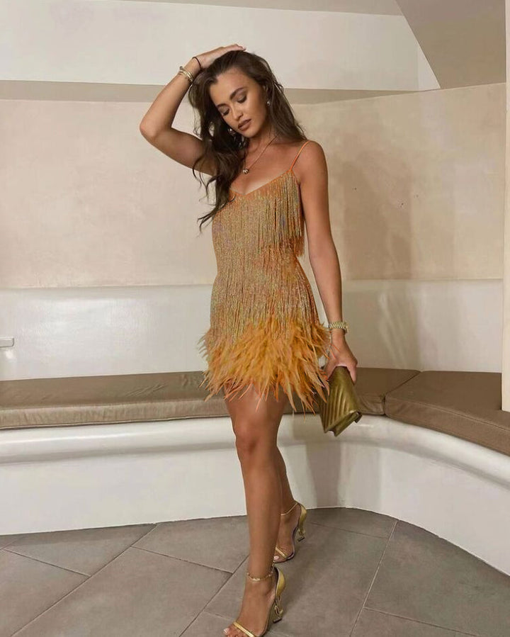 Dazzling women's cocktail dress, full sequin design with elegant feather hem, a glamorous choice for parties.