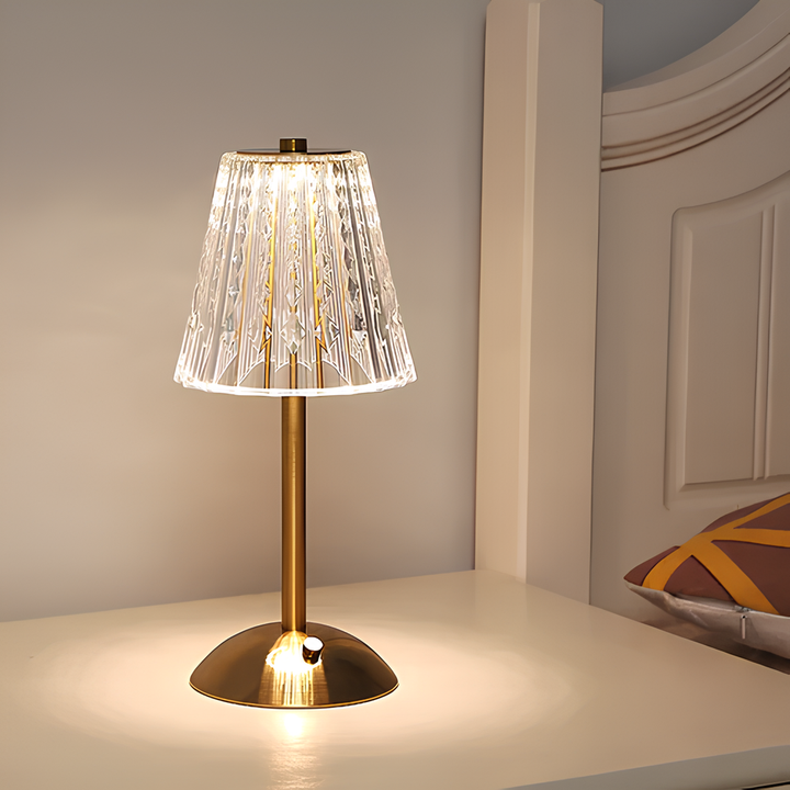 Detailed view of the golden crystal lamp's base and touch control interface