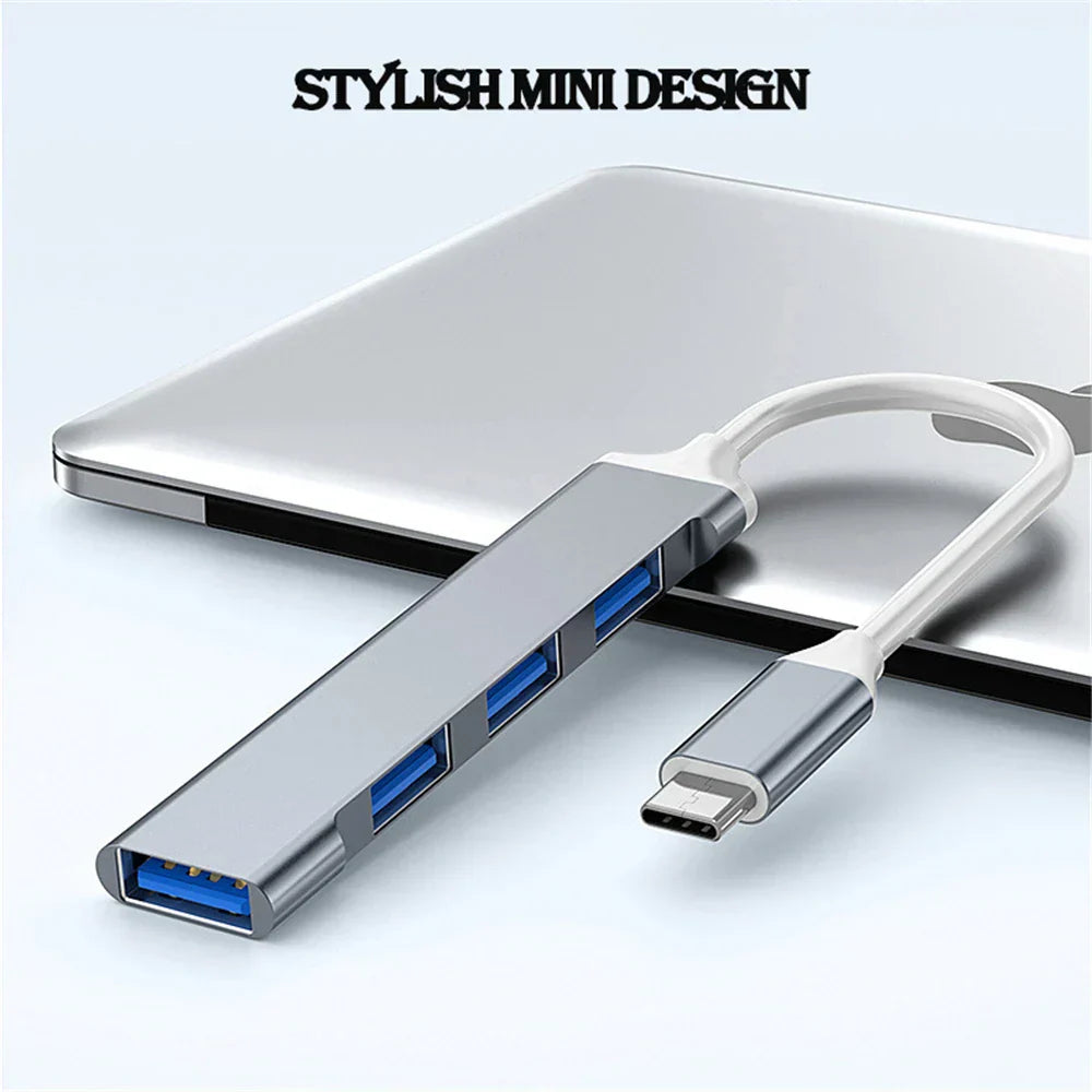 Compact gray 4-port USB splitter, perfect for expanding laptop connectivity, portable design