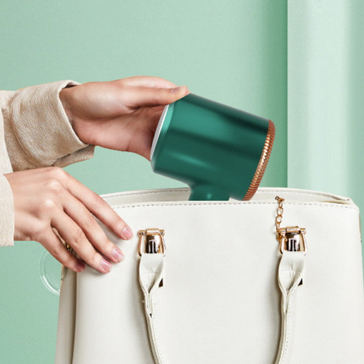 Sleek green portable USB rechargeable lint remover, perfect for restoring garments.