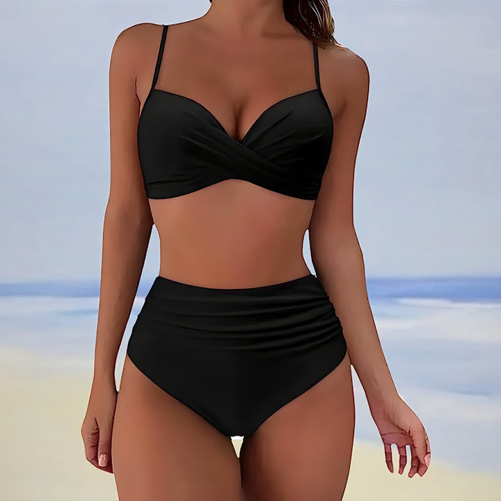 Woman posing in high-waisted bikini at sunset, stylish and comfortable vacation swimwear