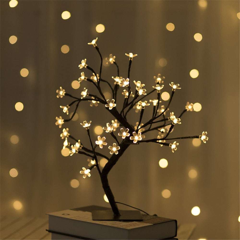 Illuminated cherry blossom tree lamp with LED lights, perfect for home decor and ambient lighting.