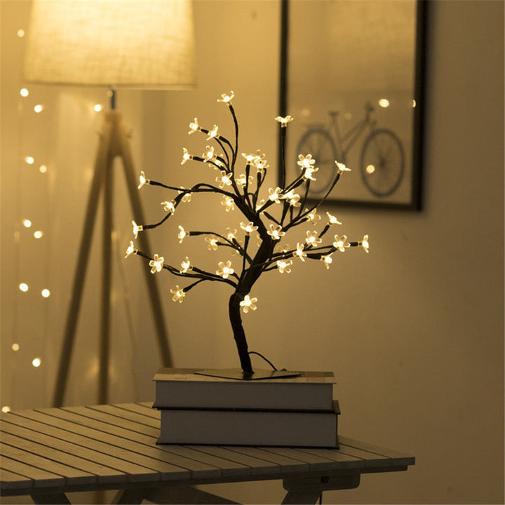 Elegant cherry blossom tree lamp for home decor, featuring soft LED lighting and flexible branches.