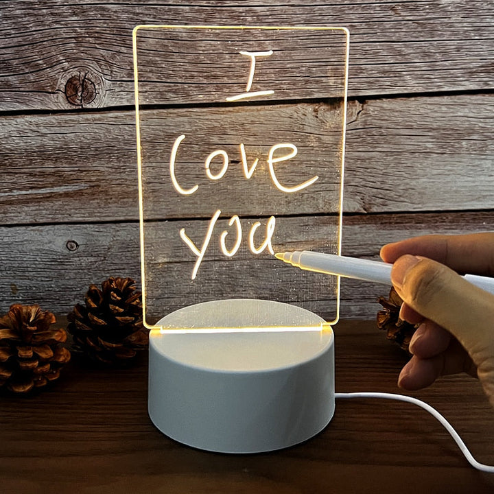 Illuminated memo board with glowing message and LED light in a dimmed room