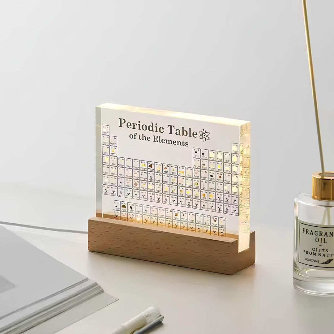 Real element samples embedded in an illuminated acrylic periodic table, advanced chemistry learning