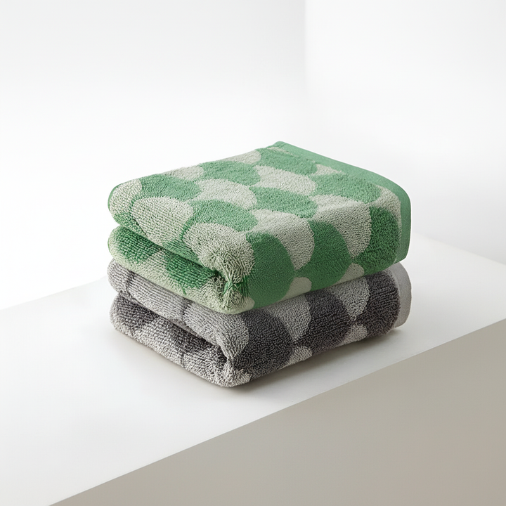 Luxury jacquard cotton hand towel, fan motif, an absorbent and soft addition to any modern bathroom.