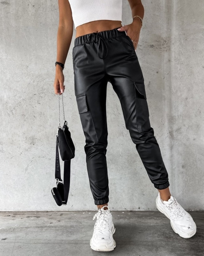 Comfortable women's jade faux leather cargo trousers, offering an edgy style. Ideal for trendy casual wear or night out.