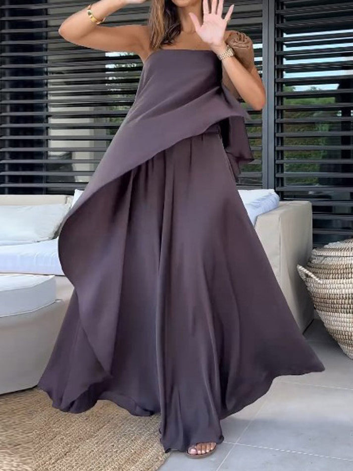 Women's purple off-shoulder blouse and maxi skirt set. Elegant two-piece for casual summer or vacation.