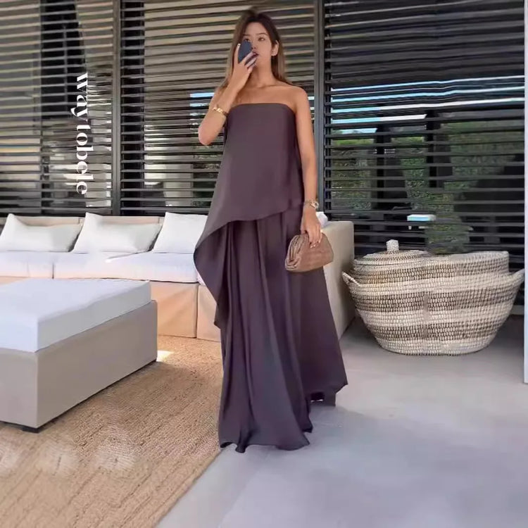 Stylish Jolina women's off-shoulder blouse & maxi skirt set in purple. Comfortable two-piece summer vacation outfit.
