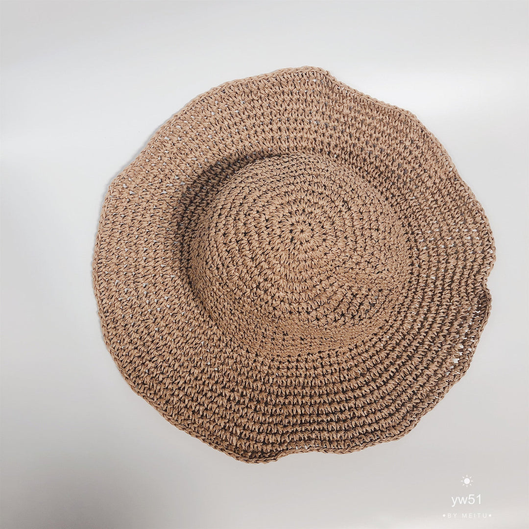 Lightweight women's summer hat in beige, designed for sun protection and easy travel