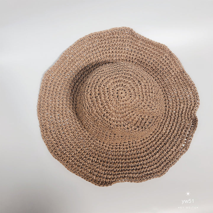 Lightweight women's summer hat in beige, designed for sun protection and easy travel