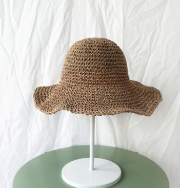 Women's travel-friendly khaki beach hat, offering lightweight sun protection for summer