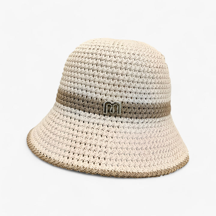 Elegant women's beige wide brim sun hat, ideal for beach, travel, and sun protection in summer